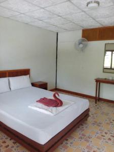 En eller flere senge i et værelse på Scenery Guest House