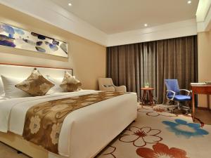 Rúm í herbergi á Qin Huang Yong An Hotel