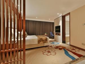 Rúm í herbergi á Qin Huang Yong An Hotel