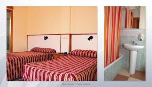 A bed or beds in a room at Hotel Emilio