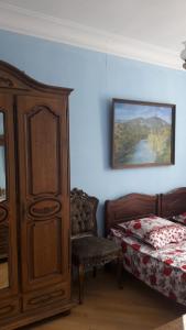 En eller flere senge i et værelse på Hotel MMG