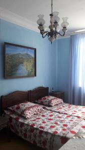 En eller flere senge i et værelse på Hotel MMG