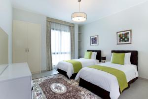 The Grove Resort Bahrain客房内的一张或多张床位
