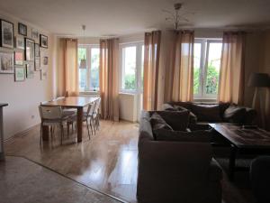 a living room with a couch and a table at Nella in Darłowo +22 photos