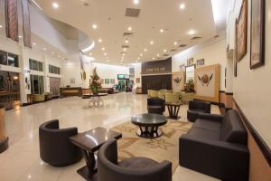 a lobby of a hospital with couches and tables at Hotel Seri Malaysia Lawas in Lawas