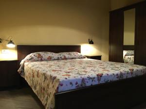 Letto o letti in una camera di Alloggio del Grand Tour
