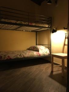 Letto o letti in una camera di Alloggio del Grand Tour