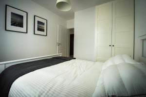 Posteľ alebo postele v izbe v ubytovaní Apartament w Piszu