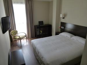 Postel nebo postele na pokoji v ubytování Hotel Río Hortega