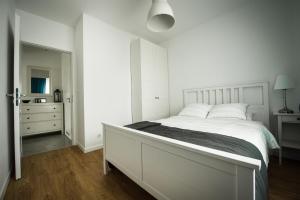 Posteľ alebo postele v izbe v ubytovaní Apartament w Piszu