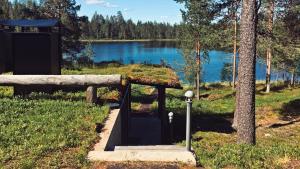 a small shelter with a view of a lake at The Little Elk in Ruka