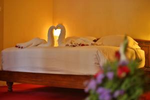 Postel nebo postele na pokoji v ubytování Deshadan Cliff & Beach Resort,Varkala