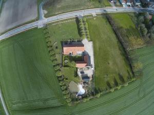 an aerial view of a house in a field at Modern Home in Geel with Sauna in Nederheide