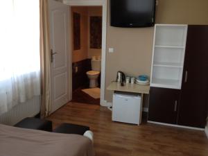 a small room with a bed and a bathroom at Villa Karolina in Mielno +35 photos
