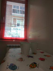 A bed or beds in a room at Betiko