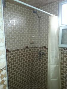 a shower with a glass door in a bathroom at House Dea Dea in Chakvi +42 photos