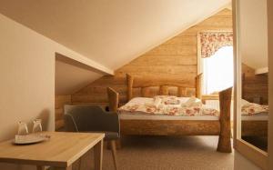 Posteľ alebo postele v izbe v ubytovaní Penzión Hučava