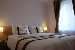 Posteľ alebo postele v izbe v ubytovaní Diana Apartments Karlovy Vary