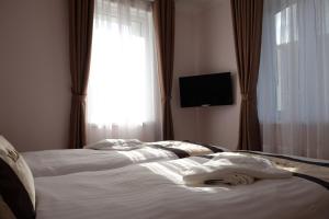 Posteľ alebo postele v izbe v ubytovaní Diana Apartments Karlovy Vary