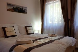 Posteľ alebo postele v izbe v ubytovaní Diana Apartments Karlovy Vary