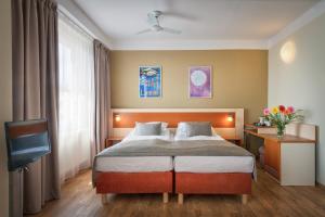 Postel nebo postele na pokoji v ubytování Hotel Aida