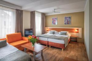 Cama o camas de una habitación en Hotel Aida