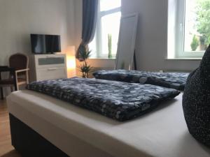 Ein Bett oder Betten in einem Zimmer der Unterkunft Citywohnung Halle Saale