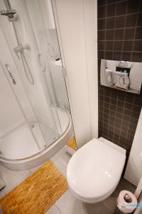 Ванная комната в Warsaw Concierge Polin Apartment