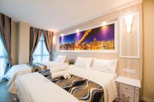 Postel nebo postele na pokoji v ubytování Lavender Inn USJ