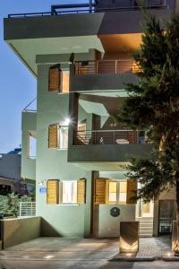a building with balconies on the side of it at Candia Studios & Rooms in Heraklio Town