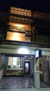 an outside view of a building at night at Swallow Home in Hengchun