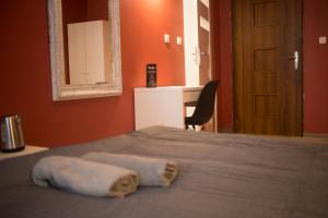 Posteľ alebo postele v izbe v ubytovaní Apartamenty Nowy Rynek