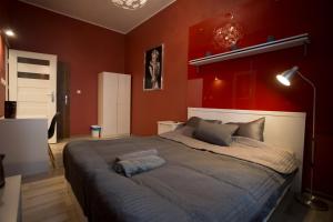 Posteľ alebo postele v izbe v ubytovaní Apartamenty Nowy Rynek