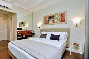 Letto o letti in una camera di Piazza Venezia Grand Suite