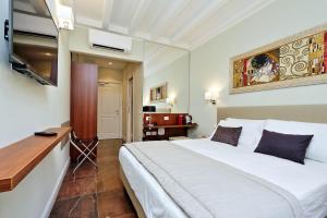 Letto o letti in una camera di Piazza Venezia Grand Suite