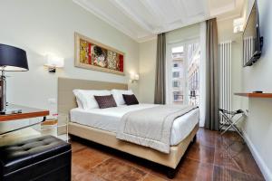 Letto o letti in una camera di Piazza Venezia Grand Suite