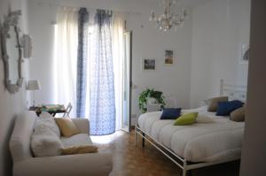 a living room with two beds and a couch at Rome Guest Hospitality in Rome