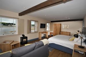 a bedroom with a bed and a couch at The Seagate in Appledore