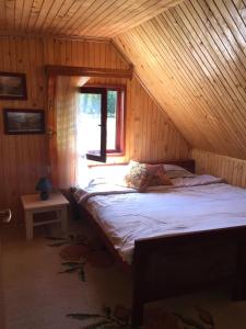 En eller flere senge i et værelse på Homestay Djerkovic