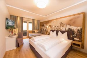 Posteľ alebo postele v izbe v ubytovaní Übergossene Alm Resort + 37 fotografií