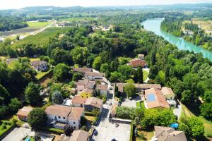 an aerial view of a village next to a river at Corte Attilea in Valeggio sul Mincio