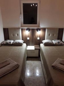 Postel nebo postele na pokoji v ubytování Apartments Lux Life