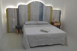 Ένα ή περισσότερα κρεβάτια σε δωμάτιο στο My Eco Rooms Olbia
