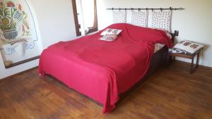 A bed or beds in a room at Pisanata House