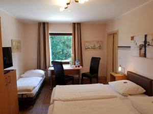 Hotel Garni Gasthof Bucksande tesisinde bir odada yatak veya yataklar