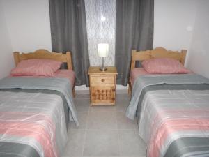 Postel nebo postele na pokoji v ubytování Tropical Paradise Apartment + 17 fotografií