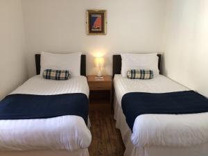 En eller flere senge i et værelse på Starfish Rooms