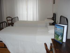Postel nebo postele na pokoji v ubytování Santuario di Oropa