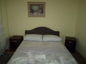 Postel nebo postele na pokoji v ubytování Hotel Le Village