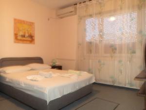 Postel nebo postele na pokoji v ubytování Hotel Le Village